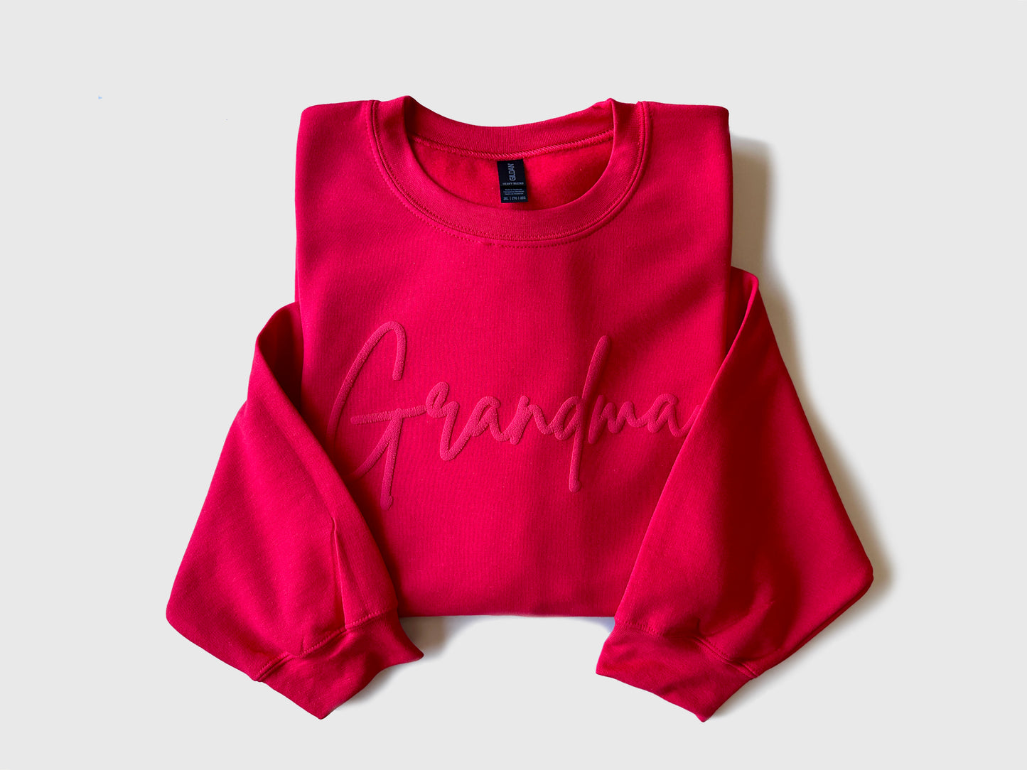 Custom Grandma Embossed Sweatshirt with Name on Sleeve