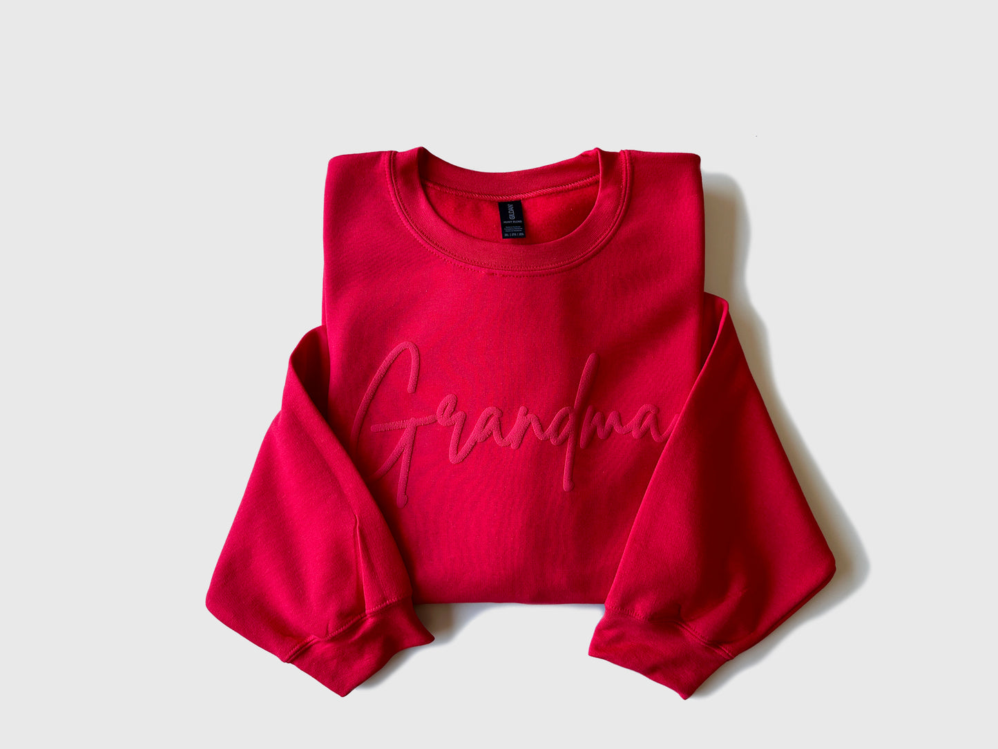 Custom Grandma Embossed Sweatshirt with Name on Sleeve